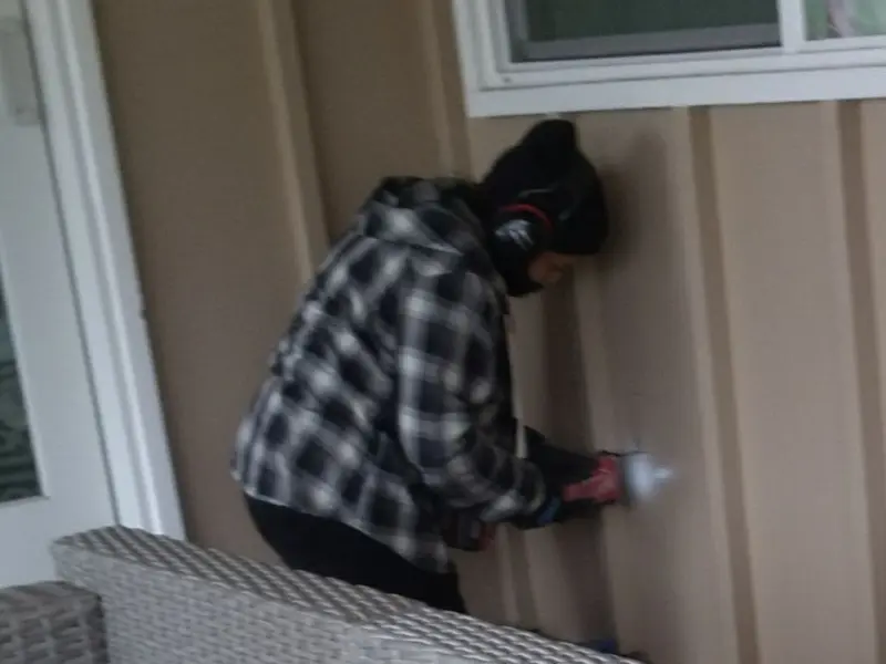 Professional electrician installing an exterior outlet in Delmar